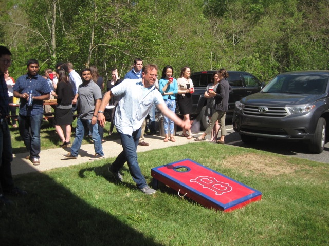 Veristat Employees Playing Cornhole Toss Games