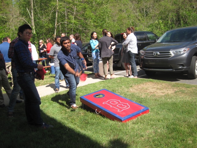 Veristat Employees Playing Cornhole Toss Games
